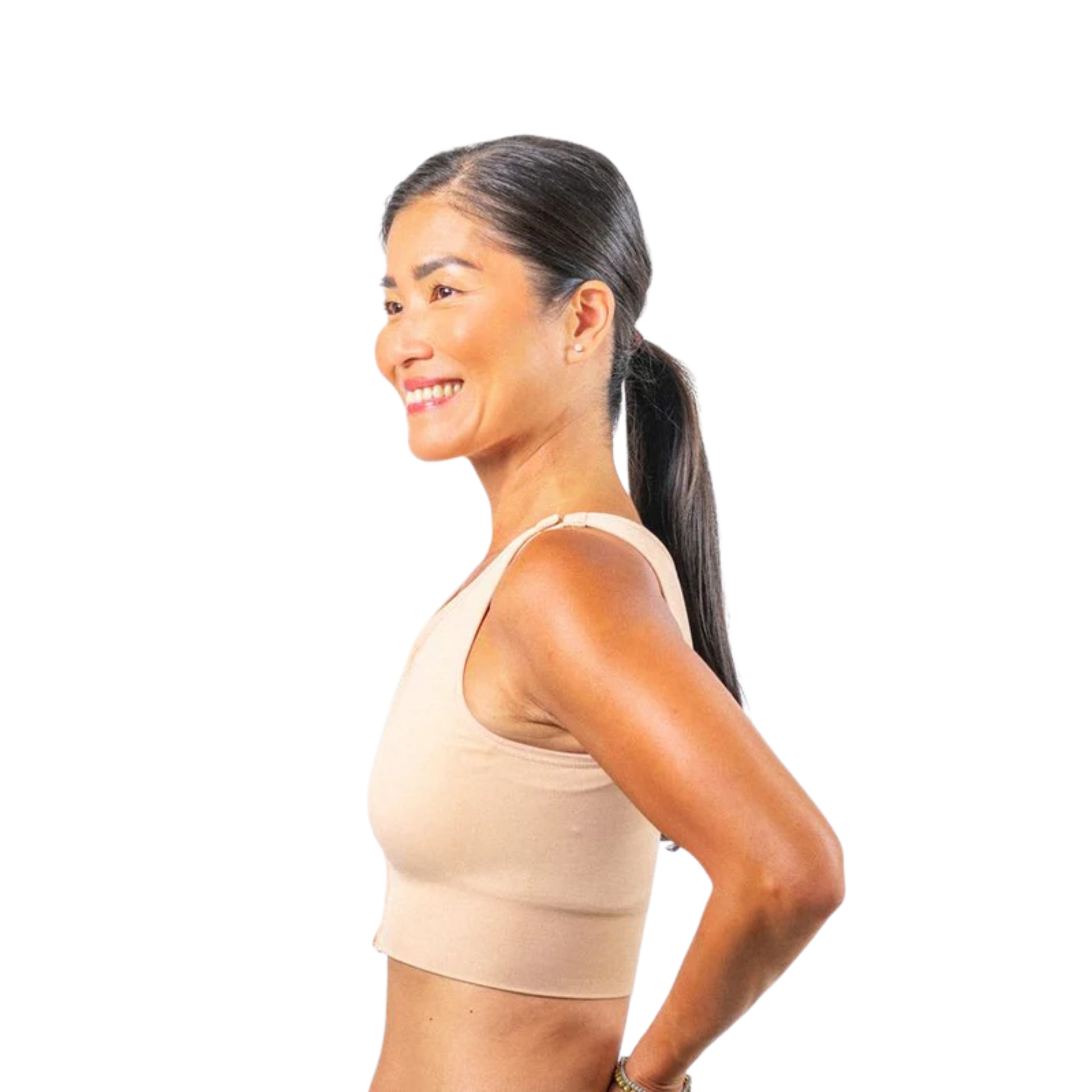 Side profile view of Prairie Wear HuggerPRIMA compression bra showing adjustable padded straps and front zip closure, beige.